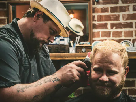Barber styling hair and beard together